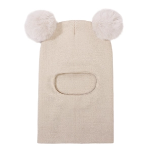 Close-up of beige knitted balaclava for kids with two fluffy faux fur pom-poms on top