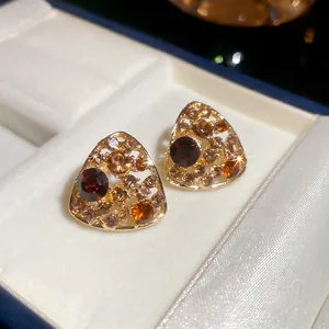 Vintage hollow triangle earrings with amber crystals in a white satin gift box