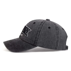 Close-up of NEW YORK embroidery on vintage charcoal grey washed cotton baseball cap
