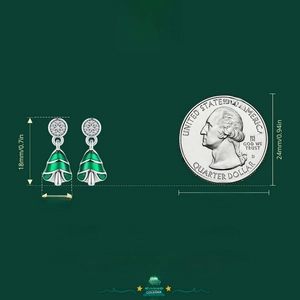 Size reference of S925 sterling silver Christmas tree earrings next to a quarter coin