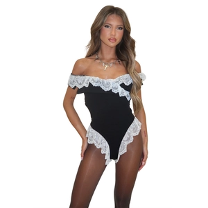 Close-up of black sleeveless bodysuit featuring elegant white lace trim and off-shoulder cut