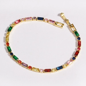 Macro detail of colorful square zircon gold-plated bracelet with mixed gemstones
