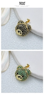 Close-up of 18K gold plated bear pendants in black and green colors with crystal inlay