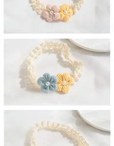 Close-up of soft lace baby headbands with handmade floral decor and pearl accents