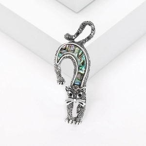 Vintage silver cat brooch with colorful abalone shell inlay and black rhinestones