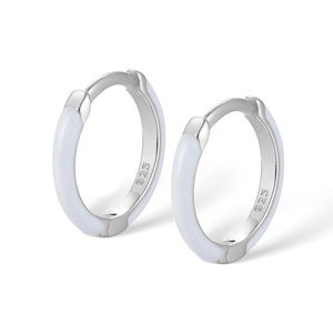 Detailed close-up of 925 sterling silver hoop earrings with white enamel finish