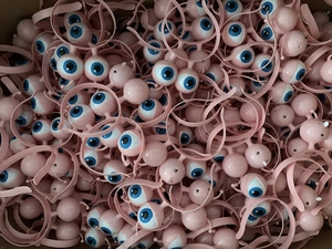 Batch of pink LED alien eyeball headbands with blue pupils for Halloween decorations