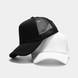 Detail of black and white breathable mesh trucker hats with structured foam panels