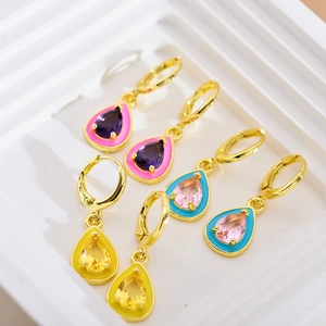 Detailed close-up of colorful teardrop gemstone earrings with vibrant enamel borders