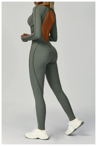 Detail of cross-back hollow cut and contrast stitching on yoga bodysuit