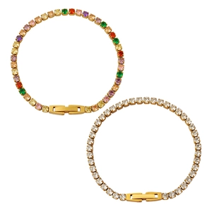 Set of two gold tennis bracelets featuring rainbow zircons and clear white stones