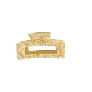 Rectangle acetate hair claw clip with cream marble texture in hollow geometric design