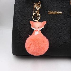 Süßer orangefarbener Fuchs-Lederanhänger mit flauschigem Pelzbommel und Goldkarabiner