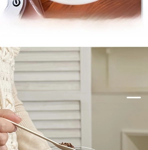 Detail of wide mouth thermos with long wooden spoon for easy cleaning and brewing