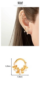 Detail of gold leaf cartilage earring with marquise zircon, measuring 1.29cm by 1.38cm