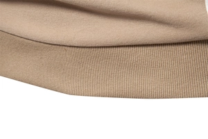 Detailed macro view of the khaki ribbed hem and knitted texture of the men's sweatshirt