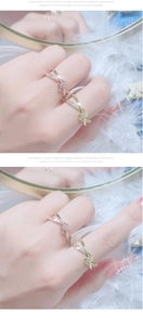 Close-up of interlocking gold and rose gold rings with micro-inlaid diamond accents