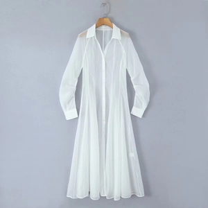 Detail of white long-sleeved sheer maxi dress with shirt collar and front buttons