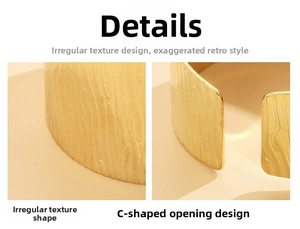 Detail of vintage wide irregular texture and C-shape opening on gold stainless steel cuff