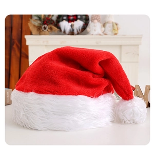 Close-up of plush red Christmas hat with white fuzzy trim and built-in LED glowing lights