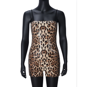 Detailed view of leopard print sequins and slim fit cut on the sexy halter neck bodysuit