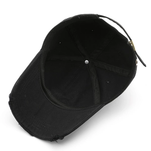Vintage black washed baseball cap with distressed details and adjustable metal buckle