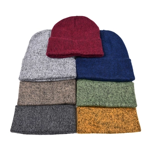 Detailed view of assorted colors and textured knit fabric of the winter beanies