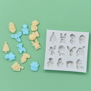 Christmas themed 12-cavity white silicone mold with tree and reindeer shapes