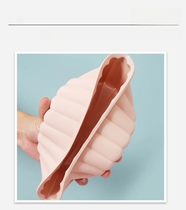 Pink silicone sunflower cake mold showing high flexibility and elastic durability
