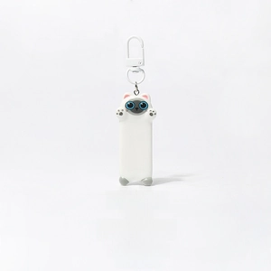 Close-up of a cute Siamese cat keychain with a white D-ring clasp on a clean white background