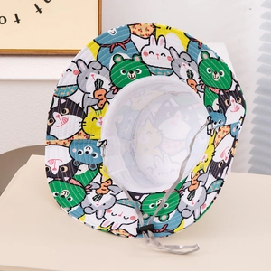 Detail of children's sun hat featuring colorful animal print and breathable mesh lining