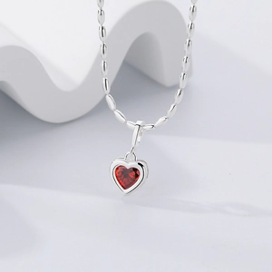 Elegant 925 sterling silver heart necklace with a vibrant red birthstone gemstone pendant