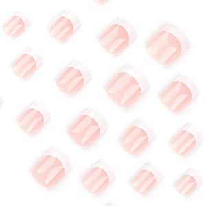 French tip press-on nails in light nude pink with white edges in various sizes