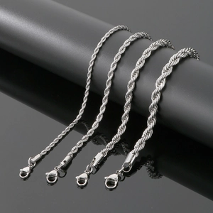 Detailed comparison of four different thickness silver rope chains on a black display stand