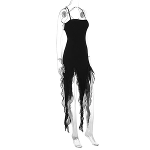 Detail view of the asymmetric ruffled mesh hem on this slim fit black strap dress