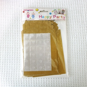Detail of glitter gold photo banner packaging for baby first birthday party decor