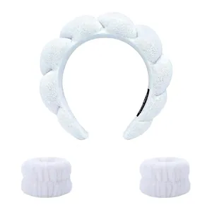 Three-piece white spa set including twisted microfiber headband and matching wristbands