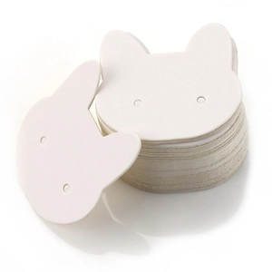 Stack of white cat-shaped cardboard earring display cards with precut holes for jewelry