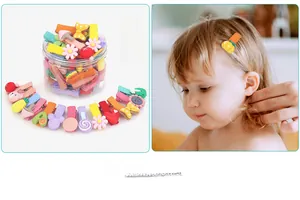 Detail of colorful kids hair clips set with cute patterns in a clear storage jar