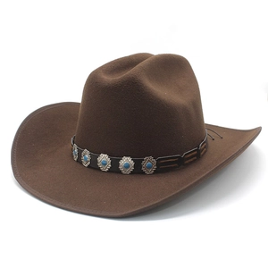 Detail of dark brown wool cowboy hat featuring a leather band with turquoise metal accents