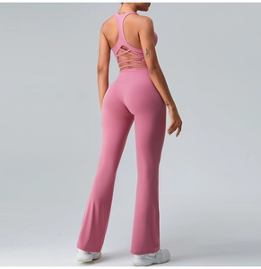 Back view of high-waist flared yoga pants and racerback sports bra in purple finish