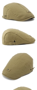 Detail view of khaki cotton newsboy cap featuring adjustable metal buckle and stitching