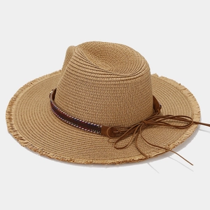Detailed macro view of woven straw texture and ethnic style feather band decoration