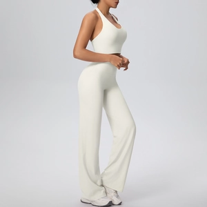 Side view of white halter yoga top and high-waist wide-leg pants set on a model