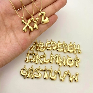 Detailed collection of golden puffy balloon letter pendants showing A-W and hand models