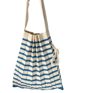 Minimalist blue and beige striped knit pleated tote bag with stylish knotted shoulder strap