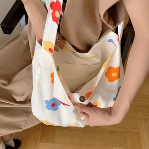 Top view of large canvas tote bag interior showing inner pocket and floral pattern