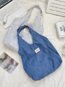 Blue and beige plaid canvas tote bags in a minimalist Korean style aesthetic flat lay