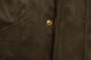 Macro detail of dark olive suede jacket showing golden metal snap button and stitching