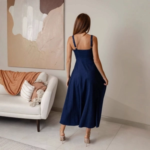 Slim fit backless denim A-line camisole dress in deep blue, modern living room setting